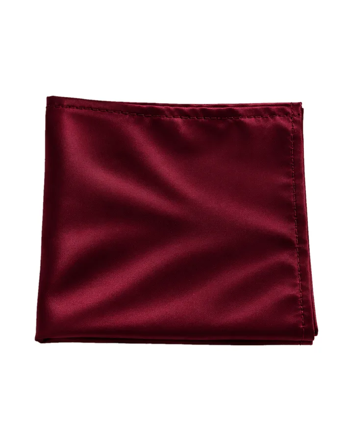 Folded burgundy KSIC silk pocket square with a stitched hem